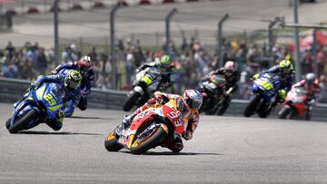 Marc Marquez (93), of Spain, is followed by Andrea Iannone (29), of Italy, and the rest of the field through a turn during the Grand Prix of the Americas motorcycle race at the Circuit Of The Americas in Austin, Texas, Sunday, April 22, 2018. (AP Photo/Er