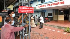 Staff members install a sign reading "Nipah isolation ward, entry strictly prohibited" at a hospital where a ward is being prepared for suspected Nipah virus patients in Kozhikode district, Kerala, India, September 12, 2023. REUTERS/Stringer NO RESALES. NO ARCHIVES