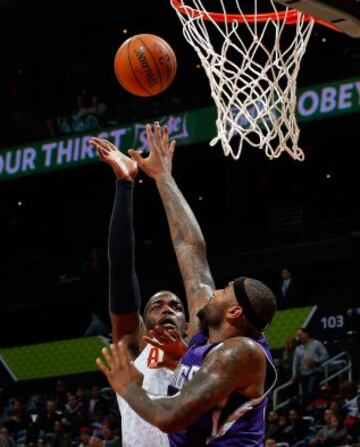 Paul Millsap y DeMarcus Cousins.