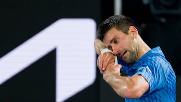 MELBOURNE, AUSTRALIA - JANUARY 29: Novak Djokovic of Serbia reacts after celebrating with his team after winning the Men's Singles Final match against Stefanos Tsitsipas of Greece during day 14 of the 2023 Australian Open at Melbourne Park on January 29, 2023 in Melbourne, Australia. (Photo by Andy Cheung/Getty Images)