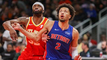 Dec 18, 2023; Atlanta, Georgia, USA; Detroit Pistons guard Cade Cunningham (2) boxes out Atlanta Hawks guard Wesley Matthews (32) in the second quarter at State Farm Arena. Mandatory Credit: Brett Davis-USA TODAY Sports