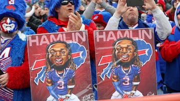 ORCHARD PARK, NEW YORK - JANUARY 08: Buffalo Bills fans hold signs in support of Buffalo Bills safety Damar Hamlin during a game against the New England Patriots at Highmark Stadium on January 08, 2023 in Orchard Park, New York. Hamlin suffered cardiac arrest during the Bills' Monday Night Football game against the Cincinnati Bengals and remains in intensive care.   Bryan M. Bennett/Getty Images/AFP (Photo by Bryan M. Bennett / GETTY IMAGES NORTH AMERICA / Getty Images via AFP)