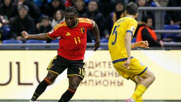 Belgium's forward #11 Jeremy Doku and Kazakhstan's defender #05 Bagdat Kairov vie for the ball during the FIFA World Cup 2026 qualifiers Europe zone group J football match between Kazakhstan and Belgium at the Astana Arena in Astana on November 15, 2025. (Photo by STANISLAV FILIPPOV / AFP)