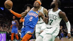 Shai Gilgeous-Alexander #2 of the Oklahoma City Thunder goes past Jaylen Brown #7 of the Boston Celtics