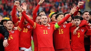 CARDIFF, WALES - JUNE 05: Gareth Bale of Wales celebrates with teammates after their sides victory, which qualifies Wales for the 2022 FIFA World Cup during the FIFA World Cup Qualifier between Wales and Ukraine at Cardiff City Stadium on June 05, 2022 in