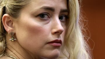 Actor Amber Heard waits before the jury said that they believe she defamed ex-husband Johnny Depp while announcing split verdicts in favor of both her ex-husband Johnny Depp and Heard on their claim and counter-claim in the Depp v. Heard civil defamation trial at the Fairfax County Circuit Courthouse in Fairfax, Virginia, U.S., June 1, 2022. REUTERS/Evelyn Hockstein/Pool