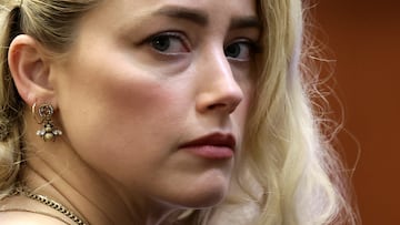 Actor Amber Heard waits before the jury said that they believe she defamed ex-husband Johnny Depp while announcing split verdicts in favor of both her ex-husband Johnny Depp and Heard on their claim and counter-claim in the Depp v. Heard civil defamation trial at the Fairfax County Circuit Courthouse in Fairfax, Virginia, U.S., June 1, 2022. REUTERS/Evelyn Hockstein/Pool