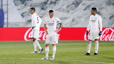 Raphaël Varane (left), Toni Kroos (centre) and Casemiro look dejected as Real Madrid slip to defeat at home to Alavés in LaLiga on Saturday.