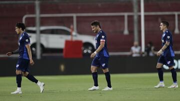 Players of Uruguay's Nacional leave the field at the end of a Copa Libertadores quarterfinal first leg soccer match against Argentina's River Plate at the Libertadores de America stadium in Buenos Aires, Argentina, Thursday, Dec. 10, 2020. River Plate won 2-0. (Juan Ignacio Roncoroni/Pool via AP)