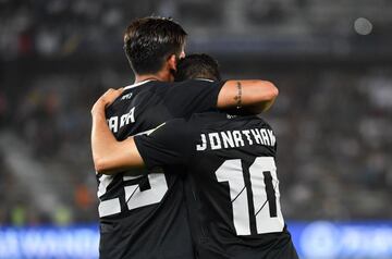 CF Pachuca's Argentinian forward Franco Jara celebrates with his Uruguayan teammate Jonathan Urretaviscaya after scoring a goal during the third place football match of the FIFA Club World Cup UAE 2017 between Al-Jazira and CF Pachuca at the Bin Zayed Sta