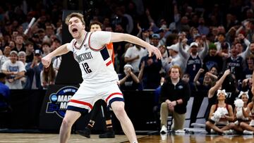 Mar 30, 2024; Boston, MA, USA; Connecticut Huskies guard Cam Spencer (12) reacts against the Illinois Fighting Illini in the finals of the East Regional of the 2024 NCAA Tournament at TD Garden. Mandatory Credit: Winslow Townson-USA TODAY Sports