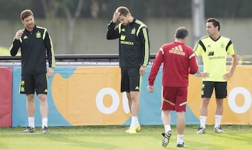 Xavi seen training alongside Gerard Piqué (and Xabi Alonso) during the 2014 World Cup in Brazil.