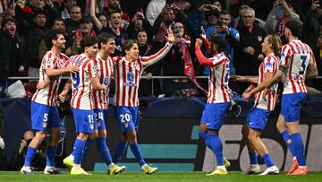 Atletico players celebrate their fourth goal scored by Atletico Madrid's Spanish defender #24 Robin Le Normand (3L) during the UEFA Champions League last 16 first leg football match between Club Atletico de Madrid and Tottenham Hotspur at Metropolitano Stadium in Madrid on March 10, 2026. (Photo by Javier SORIANO / AFP)