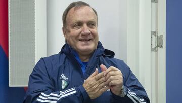 Feyenoord's head coach Dick Advocaat uses hand sanitizer to protect against coronavirus before a news conference on the eve of the Europa League Group K soccer match between CSKA Moscow and Feyenoord at CSKA Arena in Moscow, Russia, Wednesday, Nov. 2