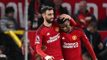 Manchester United's Ivorian midfielder #16 Amad Diallo (R) celebrates with Manchester United's Portuguese midfielder #08 Bruno Fernandes (L) after scoring his team second goal during the English Premier League football match between Manchester United and Newcastle United at Old Trafford in Manchester, north west England, on May 15, 2024. (Photo by Oli SCARFF / AFP) / RESTRICTED TO EDITORIAL USE. No use with unauthorized audio, video, data, fixture lists, club/league logos or 'live' services. Online in-match use limited to 120 images. An additional 40 images may be used in extra time. No video emulation. Social media in-match use limited to 120 images. An additional 40 images may be used in extra time. No use in betting publications, games or single club/league/player publications. /