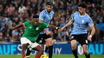 Basque Country�s forward #07 Alvaro Djalo (L) kicks the ball to score his team's first goal during the international friendly football match between Basque Country and Uruguay at the San Mames stadium in Bilbao, on March 23, 2024. (Photo by ANDER GILLENEA / AFP)