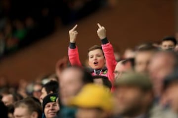 A young Norwich City fan gestures towards the Liverpool fans during the Barclays Premier League match between Norwich City and Liverpool at Carrow Road stadium on January 23, 2016 in Norwich, England. 