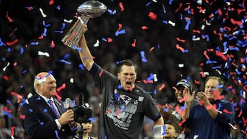 (FILES) In this file photo taken on February 5, 2017 New England Patriots&#039; quarterback Tom Brady holds the Vince Lombardi Trophy as Head coach Bill Belichick (R) looks on  after defeating the Atlanta Falcons 34-28 in overtime during Super Bowl 51 at NRG Stadium in Houston, Texas.
 With the Patriots&#039; superiority in the NFL for the past two decades, its success-story quarterback, its inflammatory coach and its owner close to Donald Trump, the Patriots appear to be a divisive team in the United States. According to a study of the BetOnline website, only four of the 50 states, unsurprisingly located in the north-east of the country, hope for a Patriot&#039;s victory as they face the Philadelphia Eagles in the Superbowl on February 4, 2018. / AFP PHOTO / Timothy A. CLARY