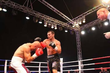 El boxeador ruso Dmitry Chudinov, durante una pelea.