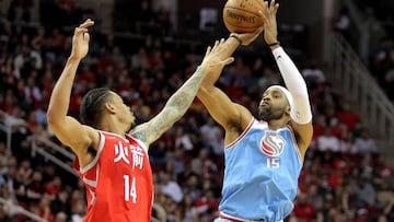 Feb 14, 2018; Houston, TX, USA; Sacramento Kings guard Vince Carter (15) shoots a jump shot while Houston Rockets guard Gerald Green (14) defends during the fourth quarter at Toyota Center. Mandatory Credit: Erik Williams-USA TODAY Sports