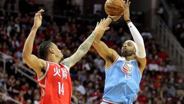 Feb 14, 2018; Houston, TX, USA; Sacramento Kings guard Vince Carter (15) shoots a jump shot while Houston Rockets guard Gerald Green (14) defends during the fourth quarter at Toyota Center. Mandatory Credit: Erik Williams-USA TODAY Sports