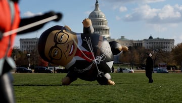 Demonstrators with MoveOn, stage a protest calling for the expulsion of U.S. Rep. George Santos (R-NY) featuring a large balloon version of Santos outside of the U.S. Capitol building Washington, U.S., November 28, 2023. REUTERS/Leah Millis