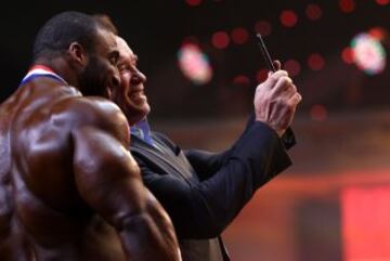 Arnold Schwarzenegger takes a selfie with Cedric McMillan.