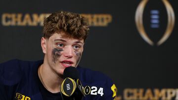 HOUSTON, TEXAS - JANUARY 08: J.J. McCarthy #9 of the Michigan Wolverines answers questions during the press conference after defeating the Washington Huskies during the 2024 CFP National Championship game at NRG Stadium on January 08, 2024 in Houston, Texas. Michigan defeated Washington 34-13.   Maddie Meyer/Getty Images/AFP (Photo by Maddie Meyer / GETTY IMAGES NORTH AMERICA / Getty Images via AFP)