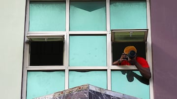 Adetona Omokanye, a 29 year-old documentary photographer, takes pictures from the window of his home in Lekki, as authorities around the world impose various guidelines on lockdowns and social distancing to curb the spread of coronavirus disease (COVID-19