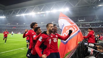 Lille's Canadian forward #09 Jonathan David (C) celebrates after opening the scoring with Lille's Kosovan forward #23 Edon Zhegrova (C-L) during the UEFA Champions League, League phase - Matchday 4 football match between Lille OSC (LOSC) and Juventus FC, at Stade Pierre Mauroy, in Villeneuve d'Ascq, northern France, on November 5, 2024. (Photo by Francois LO PRESTI / AFP)