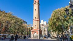 Sunny morning, bell tower in the center and bar terraces in the background