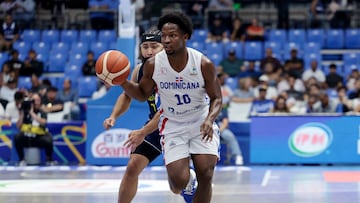 Basketball - FIBA AmeriCup 2025 - Group C - Dominican Republic v Colombia - Polideportivo Alexis Arguello, Managua, Nicaragua - August 22, 2025 Dominican Republic's Andres Feliz in action with Colombia's Romario Roque REUTERS/Luisa Gonzalez