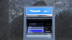 An automated teller machine operates at a branch of Sabadell bank in the Basque town of Guernica, Spain, October 26, 2022. REUTERS/Vincent West