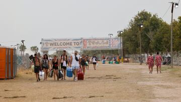 Young people leave the Medusa music festival after high winds caused part of a stage to collapse, in Cullera, near Valencia, Spain, August 13, 2022. REUTERS/Eva Manez