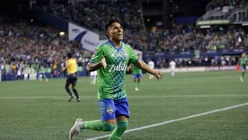 Seattle Sounders forward Raul Ruidiaz celebrates his second goal in the CONCACAF Champions League final match between Seattle Sounders and Pumas UNAM at Lumen Field in Seattle, Washington on May 4, 2022. - The Seattle Sounders defeated Mexico's Pumas UNAM 5-2 on aggregate to win the CONCACAF Champions League on Wednesday, ending Major League Soccer's 23-year wait to lift the top club tournament for teams from North America, Central America and the Caribbean.
Two goals from Peruvian international Raul Ruidiaz and a late strike from Uruguayan veteran Nicolas Lodeiro sealed a deserved 3-0 second leg victory in front of a tournament record crowd of 68,741 at Seattle's Lumen Field. Last week's first leg had ended in a 2-2 draw in Mexico City. (Photo by Jason Redmond / AFP)