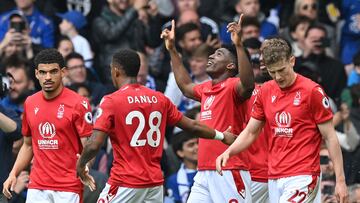 Nottingham Forest's Nigerian striker Taiwo Awoniyi (C) celebrates after scoring his team's second goal during the English Premier League football match between Chelsea and Nottingham Forest at Stamford Bridge in London on May 13, 2023. (Photo by Glyn KIRK / AFP) / RESTRICTED TO EDITORIAL USE. No use with unauthorized audio, video, data, fixture lists, club/league logos or 'live' services. Online in-match use limited to 120 images. An additional 40 images may be used in extra time. No video emulation. Social media in-match use limited to 120 images. An additional 40 images may be used in extra time. No use in betting publications, games or single club/league/player publications. / 