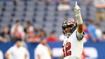 Aug 27, 2022; Indianapolis, Indiana, USA; Tampa Bay Buccaneers quarterback Tom Brady (12) holds up a number 1 before the game against the Indianapolis Colts at Lucas Oil Stadium. Mandatory Credit: Marc Lebryk-USA TODAY Sports