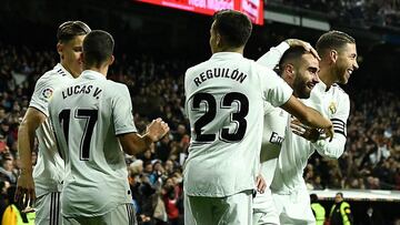 Real Madrid's Spanish defender Dani Carvajal (2ndR) celebrates with teammates after scoring a goal during the Spanish league football match between Real Madrid and Valencia at the Santiago Bernabeu stadium in Madrid on December 1, 2018. (Photo by OSC