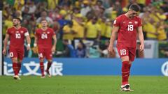 Serbia's forward #18 Dusan Vlahovic (R) reacts after Brazil's forward #09 Richarlison (not seen) scored Brazil's second goal during the Qatar 2022 World Cup Group G football match between Brazil and Serbia at the Lusail Stadium in Lusail, north of Doha on November 24, 2022. (Photo by ANDREJ ISAKOVIC / AFP)