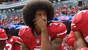 (FILES) In this file photo taken on October 02, 2016 Colin Kaepernick #7 of the San Francisco 49ers kneels on the sideline during the anthem prior to the game against the Dallas Cowboys at Levi&#039;s Stadium in Santa Clara, California. - Former San Francisco 49ers quarterback Colin Kaepernick has been chosen as the face of a new Nike advertising campaign to mark the 30th anniversary of the company&#039;s iconic &quot;Just Do It&quot; slogan, it was confirmed on September 4, 2018. Kaepernick -- who triggered a political firestorm after kneeling during the US national anthem in 2016 to protest racial injustice -- has not played in the NFL since early last year.The 30-year-old is suing the NFL, claiming he has been frozen out of the league by team owners because of his activism. (Photo by Thearon W. Henderson / GETTY IMAGES NORTH AMERICA / AFP)