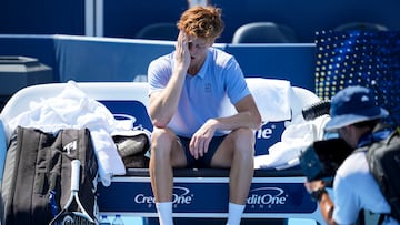 Aug 18, 2025; Cincinnati, OH, USA; Jannik Sinner (ITA) sits on his bench after retiring from his match against Carlos Alcaraz (ESP) during the Cincinnati Open at the Lindner Family Tennis Center. Mandatory Credit: Aaron Doster-Imagn Images