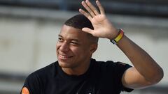 Paris Saint-Germain's French forward Kylian Mbappe waves to supporters during "Les rencontres inspirantes" (inspiring meetings) organised by his association "Inspired by KM" at The Arena of Nimes on October 12, 2022. (Photo by Sylvain THOMAS / AFP) (Photo by SYLVAIN THOMAS/AFP via Getty Images)