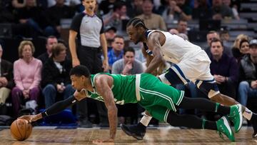 Mar 8, 2018; Minneapolis, MN, USA; Boston Celtics guard Marcus Smart (36) dives for a loose ball in the third quarter against Minnesota Timberwolves guard Andrew Wiggins (22) at Target Center. Mandatory Credit: Brad Rempel-USA TODAY Sports