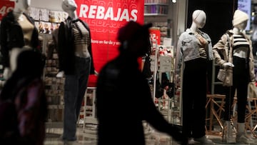 Mannequins stand behind a shop window with a display advertising reduced prices (Rebajas), near Mexico City's Zocalo main square, Mexico January 8, 2024. REUTERS/Henry Romero