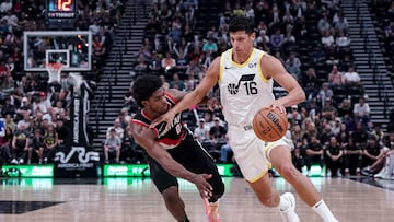 Oct 14, 2023;  Salt Lake City, Utah, USA; Utah Jazz forward Simone Fontecchio (16) rushes past Portland Trail Blazers guard Scoot Henderson (00) in the second half at Delta Center. Mandatory Credit: Gabriel Mayberry-USA TODAY Sports