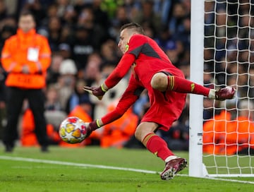 MANCHESTER, ENGLAND - APRIL 17: Real Madrid's Andriy Lunin saves a penalty kick during the UEFA Champions League quarter-final second leg match between Manchester City and Real Madrid CF at Etihad Stadium on April 17, 2024 in Manchester, England.(Photo by Alex Dodd - CameraSport via Getty Images)