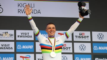 Cycling - Road World Championships 2025 - Kigali, Rwanda - September 21, 2025 Gold medallist, Belgium's Remco Evenepoel celebrates on the podium after winning the Men's Elite Individual Time Trial REUTERS/Jean Bizimana