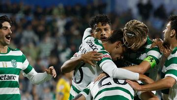 Sporting Lisbon's Colombian forward #97 Luis Suarez celebrates with teammates after scoring during the Portuguese League football match between GD Estoril Praia and Sporting CP at the Antonio Coimbra da Mota stadium in Estoril on September 27, 2025. (Photo by Filipe AMORIM / AFP)