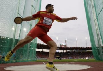 Spain's Mario Pestano competes in the Men's Discus qualifying round during the European Athletics Championships at the Letzigrund stadium in Zurich on August 12, 2014. AFP PHOTO / FRANCK FIFE