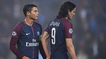 (FILES) In this file photo taken on March 6, 2018 Paris Saint-Germain's Uruguayan forward Edinson Cavani (R) and Paris Saint-Germain's Brazilian defender Thiago Silva react after losing the UEFA Champions League round of 16 second leg football m